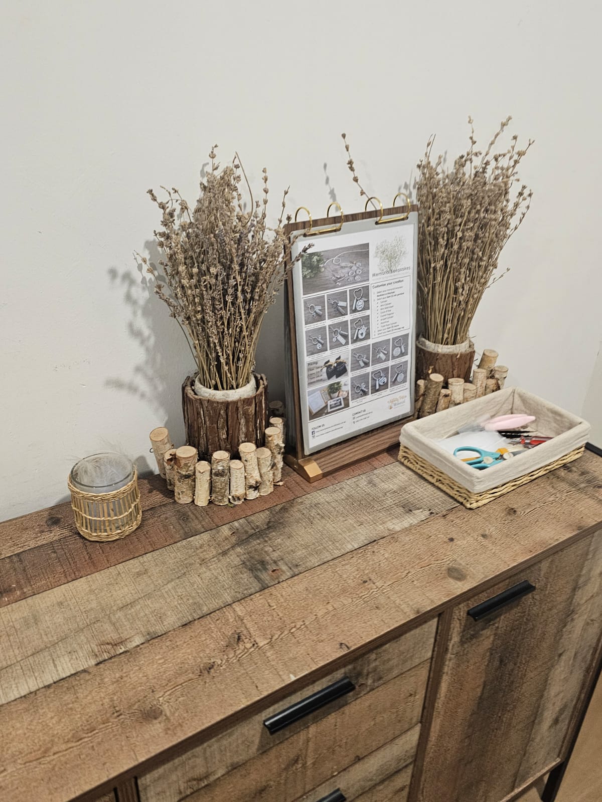 Memorial keepsake station with dried flowers and a catalogue of paw-print keepsakes